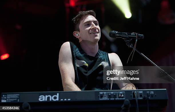 Walk the Moon singer/keyboardist Nicholas Petricca performs in concert at the Uptown Amphitheatre on August 13, 2014 in Charlotte, North Carolina.