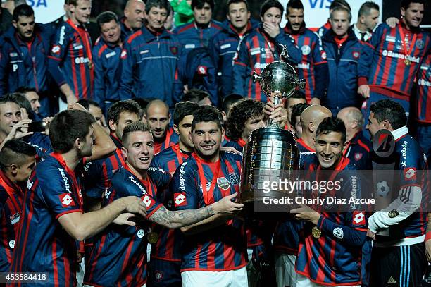 Players of San Lorenzo celebrate winning the Copa Libertadores after the second leg final match between San Lorenzo and Nacional as part of Copa...