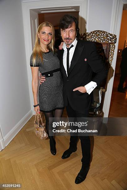 Tanja Buelter and Tom Lemke attend a photo exhibition of Tom Lemke at the Center of Aesthetics on December 4, 2013 in Berlin, Germany.