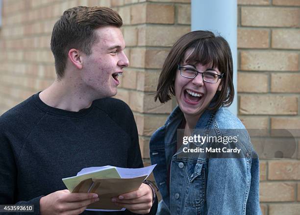 Students at the Winterbourne International Academy react as their A-level results on August 14, 2014 in South Gloucestershire, near Bristol, England....