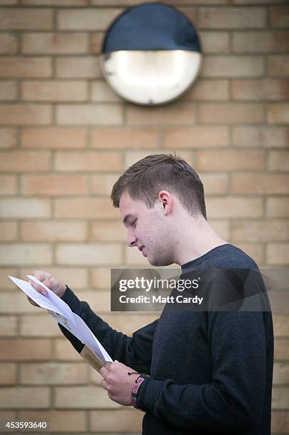 Students at the Winterbourne International Academy react as they open their A-level results on August 14, 2014 in South Gloucestershire, near...