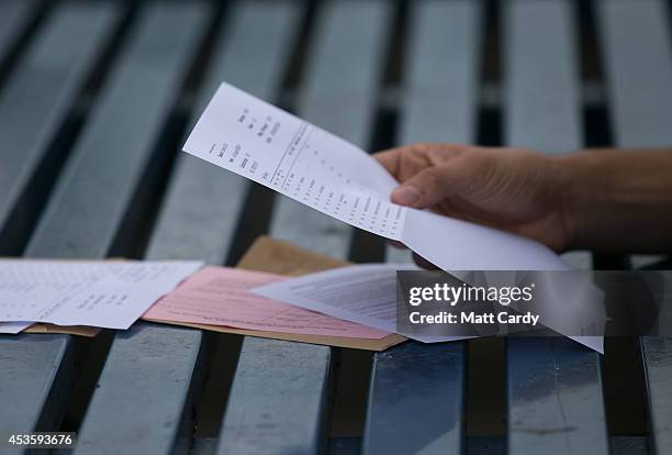 Students at the Winterbourne International Academy react as they open their A-level results on August 14, 2014 in South Gloucestershire, near...