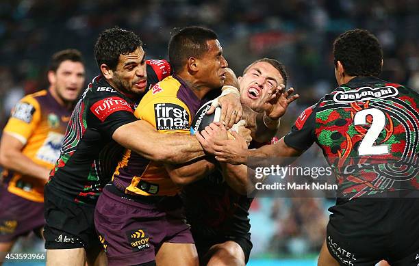 Ben Barba of the Broncos is tackled during the round 23 NRL match between the South Sydney Rabbitohs and the Brisbane Broncos at ANZ Stadium on...