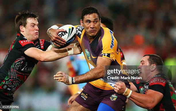 Justin Hodges of the Broncos is tackled during the round 23 NRL match between the South Sydney Rabbitohs and the Brisbane Broncos at ANZ Stadium on...