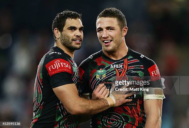 Greg Inglis and Sam Burgess of the Rabbitohs celebrate victory at the end of the round 23 NRL match between the South Sydney Rabbitohs and the...