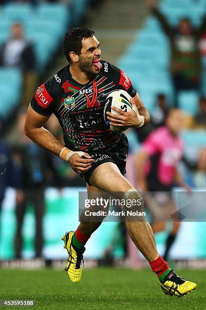 Greg Inglis of the Rabbitohs crosses the line to score a try during the round 23 NRL match between the South Sydney Rabbitohs and the Brisbane...