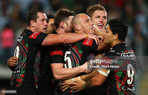 The Rabbitohs celebrate a try by Greg Inglis during the round 23 NRL match between the South Sydney Rabbitohs and the Brisbane Broncos at ANZ Stadium...