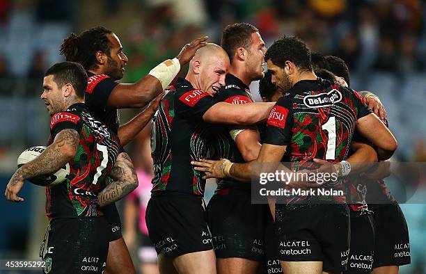 The Rabbitohs celebrate a try by Kirisome Auva'a during the round 23 NRL match between the South Sydney Rabbitohs and the Brisbane Broncos at ANZ...