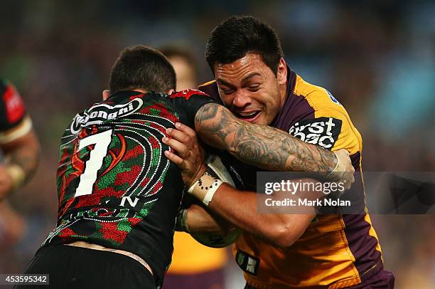 Alex Glenn of the Broncos is tackled during the round 23 NRL match between the South Sydney Rabbitohs and the Brisbane Broncos at ANZ Stadium on...