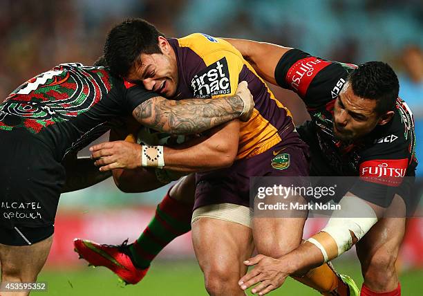 Alex Glenn of the Broncos is tackled during the round 23 NRL match between the South Sydney Rabbitohs and the Brisbane Broncos at ANZ Stadium on...