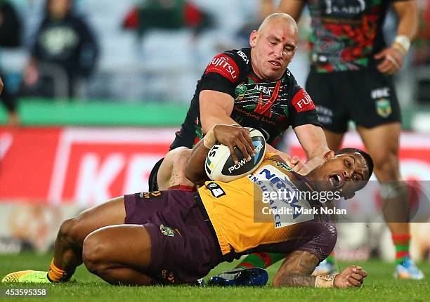 Ben Barba of the Broncos is tackled during the round 23 NRL match between the South Sydney Rabbitohs and the Brisbane Broncos at ANZ Stadium on...