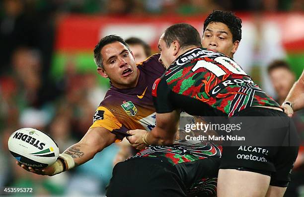 Corey Parker of the Broncos offloads during the round 23 NRL match between the South Sydney Rabbitohs and the Brisbane Broncos at ANZ Stadium on...