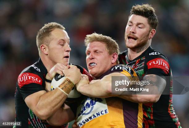 Ben Hannant of the Broncos is tackled during the round 23 NRL match between the South Sydney Rabbitohs and the Brisbane Broncos at ANZ Stadium on...