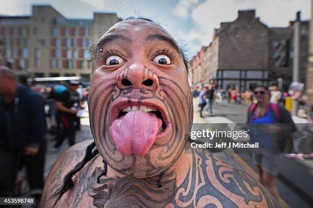 Te Matatini Kapa Haka Aotearoa perform the Haka at the Edinburgh Festival Fringe on the Royal Mile on August 14, 2014 in Edinburgh, Scotland. The...