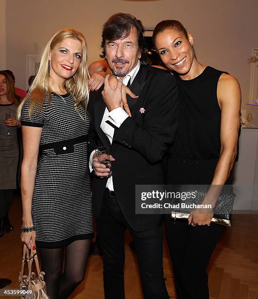 Tanja Buelter, Tom Lemke and Annabelle Mandeng attend a photo exhibition of Tom Lemke at the Center of Aesthetics on December 4, 2013 in Berlin,...