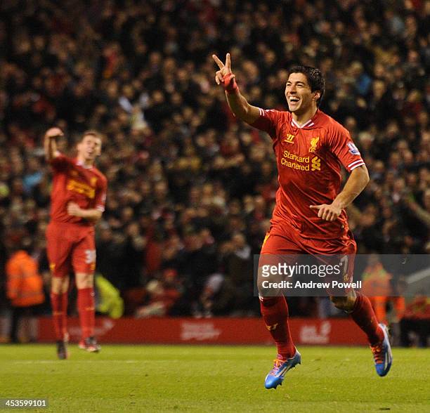 Luis Suarez of Liverpool celebrates after scoring the fourth during the Barclays Premier League match between Liverpool and Norwich City at Anfield...