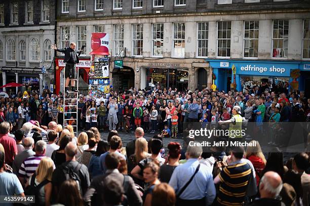 Edinburgh Festival Fringe entertainers perform on the Royal Mile on August 14, 2014 in Edinburgh, Scotland. The largest performing arts festival in...