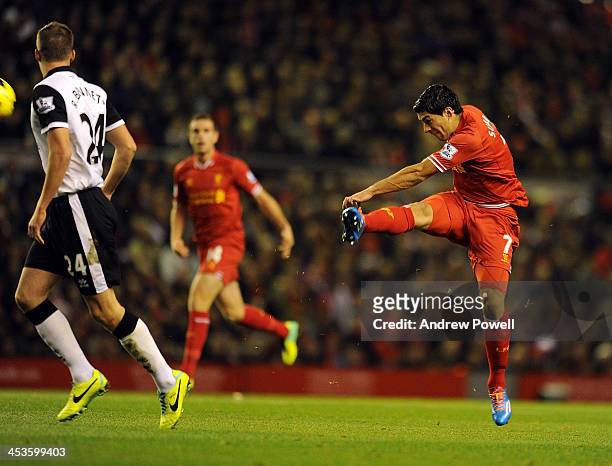 Luis Suarez of Liverpool scores the first goal during the Barclays Premier League match between Liverpool and Norwich City at Anfield on December 4,...