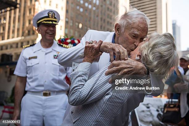 Sydnor Thompson, age 90, kisses his wife, Harriette Thompson, age 91, while reenacting the Times Square Kiss photo, taken by Alfred Eisenstaedt, to...