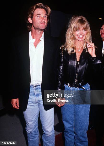 American actress Goldie Hawn with her partner, actor Kurt Russell at the 'Housesitter' Beverly Hills premiere on June 9th 1992 at the Academy Theatre...