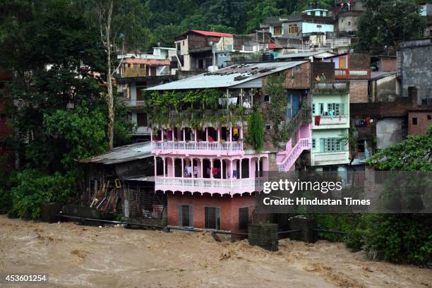 Flood in Sukheti river after heavy rains on August 14, 2014 in Mandi, India. Three persons were washed away by strong water current as rains wreaked...