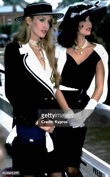 Hawaiian-born model Marie Helvin, with the American model and wife of Mick Jagger, Jerry Hall, at Royal Ascot, UK, 1982.