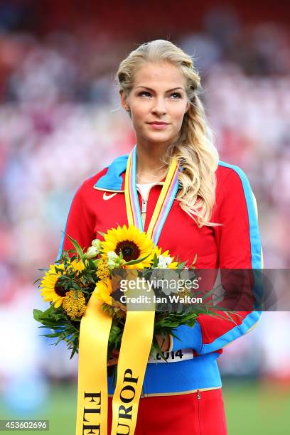 Bronze medalist Darya Klishina of Russia poses with her medal on the podium during the medal ceremony for the Women's Long Jump final during day...