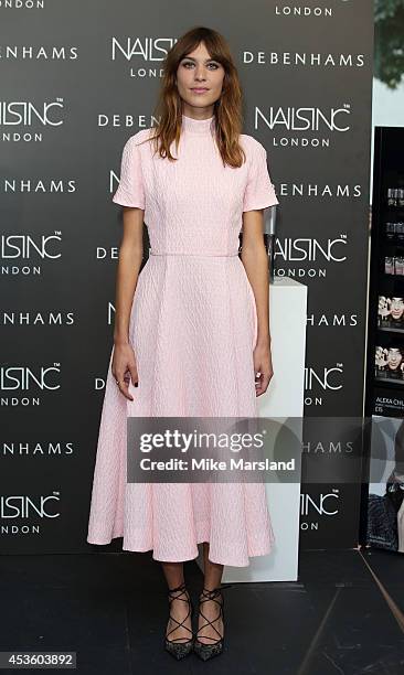 Alexa Chung attends a photocall to launch her Alexa Manicure collection with Nails Inc at Debenhams on August 14, 2014 in London, England.