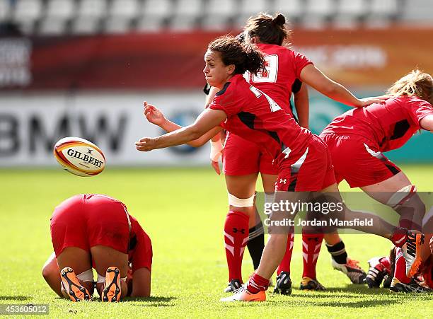 Amy Day of Wales passes the ball out of a scrum during the IRB Women's Rugby World Cup 5th place match between New Zealand and Wales at Stade Jean...