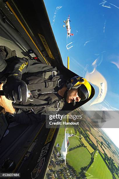 In this handout image provided by Red Bull, Nigel Lamb of Great Britain flies prior to the fifth stage of the Red Bull Air Race World Championship in...