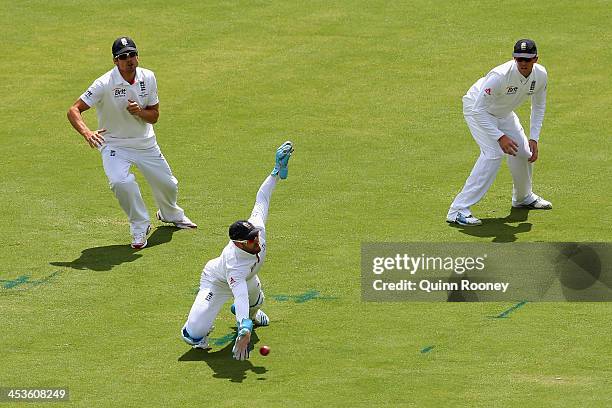 Matt Prior of England dives to field the ball during day one of the Second Ashes Test Match between Australia and England at Adelaide Oval on...