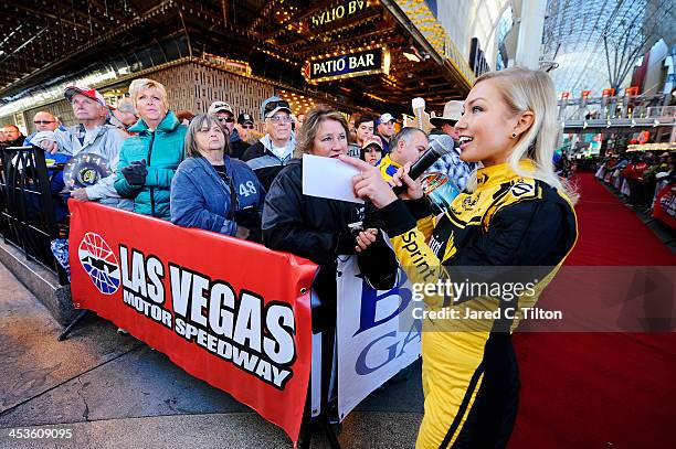 Miss Sprint Cup Brooke Werner attends a fanfest hosted by Las Vegas Motor Speedway on the Third Street Stage at the Fremont Street Experience on...