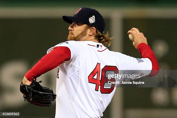 Ryan Dempster of the Boston Red Sox pitches in the ninth inning against the St. Louis Cardinals during Game One of the 2013 World Series at Fenway...