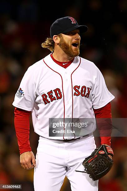 Ryan Dempster of the Boston Red Sox reacts in the ninth inning against the St. Louis Cardinals during Game One of the 2013 World Series at Fenway...