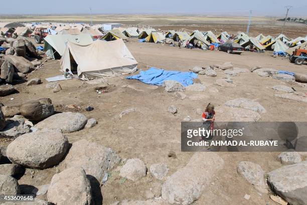 Iraqi Yazidis refugee settle in at Newroz camp in Hasaka province, north eastern Syria on August 14 after fleeing Islamic State militants in Iraq....