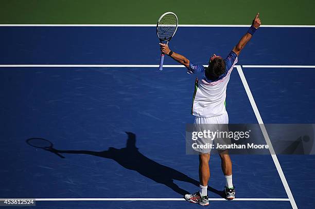 Tommy Robredo of Spain celebrates after defeating number one ranked Novak Djokovic of Serbia after a match on day 6 of the Western & Southern Open at...