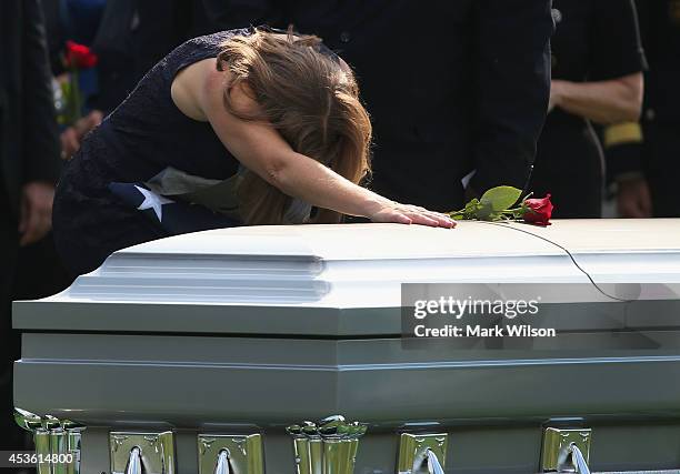 Dr. Susan Myers, mourns at the casket of her husband U.S. Army Maj. Gen. Harold J. Greene during a full honors funeral service at Arlington National...