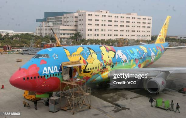 Boeing 747-400 airplane of ANA painted Pikachu is being mended in TAECO airplane project company on December 27, 2005 in Xiamen, China. The colorful...