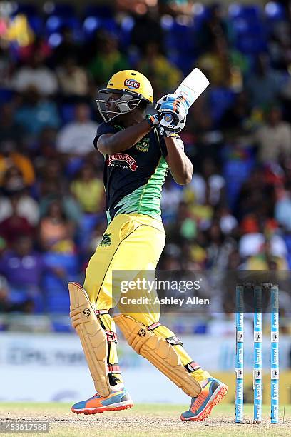 Andre Russell belts four runs through midwicket during a Semifinal match between Jamaica Tallawahs and Guyana Amazon Warriors as part of the Limacol...