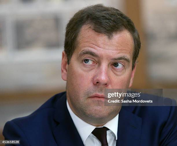 Alongside Russian President Vladimir Putin, Russian Prime Minister Dmitry Medvedev attends a meeting with Russian ministers, members of parliament,...