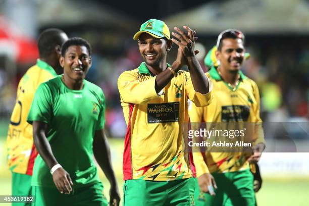 Denesh Ramdin Krishmar Santokie and Sunil Narine celebrate winning over the Jamaica Tallawahs by 10 wickets during the Semifinal match between...