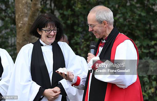 Archbishop of Canterbury, Justin Welby presents Dean of Auckland Jo Kelly-Moore with a piece of Canterbury after he unveiled a foundation stone...