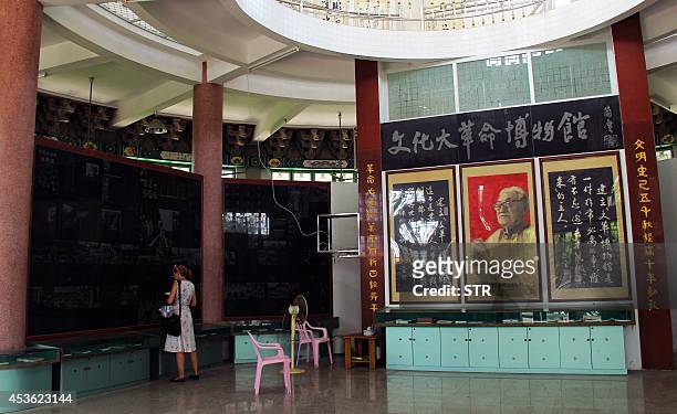 China-politics-history,FOCUS BY Felicia SONMEZ This picture taken on August 8, 2014 shows a woman visiting the Cultural Revolution museum complex in...