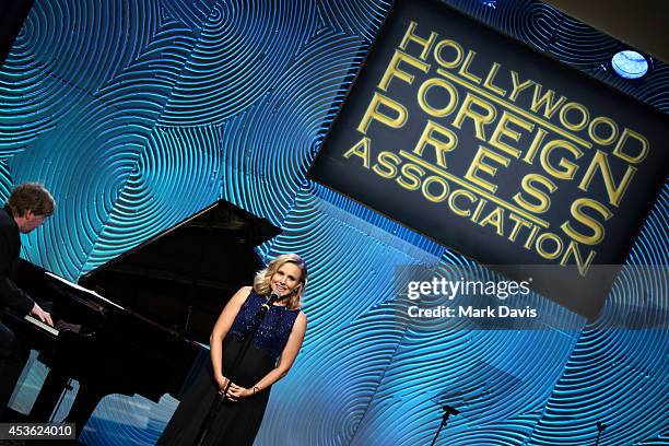Actress Kristen Bell speaks onstage at the Hollywood Foreign Press Association's Grants Banquet at The Beverly Hilton Hotel on August 14, 2014 in...