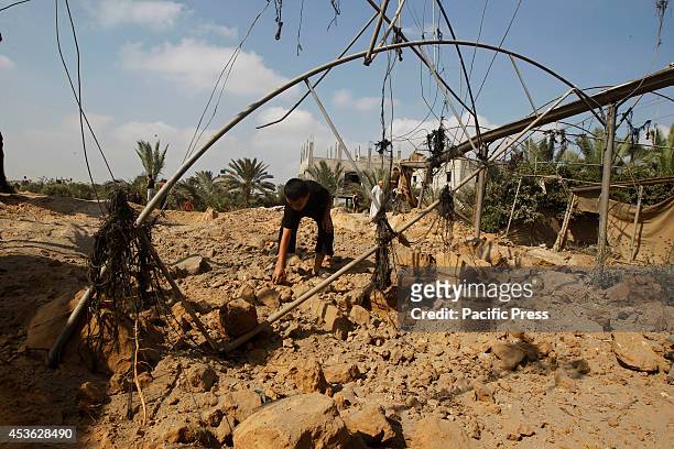 Palestinian boy inspects the damage of an Israeli air strike in some parts of Khan Younis in the Southern of Gaza City. According to the Palestinians...