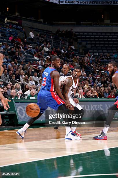 Mayo of the Milwaukee Bucks passes against Rodney Stuckey of the Detroit Pistons on December 4, 2013 at the BMO Harris Bradley Center in Milwaukee,...