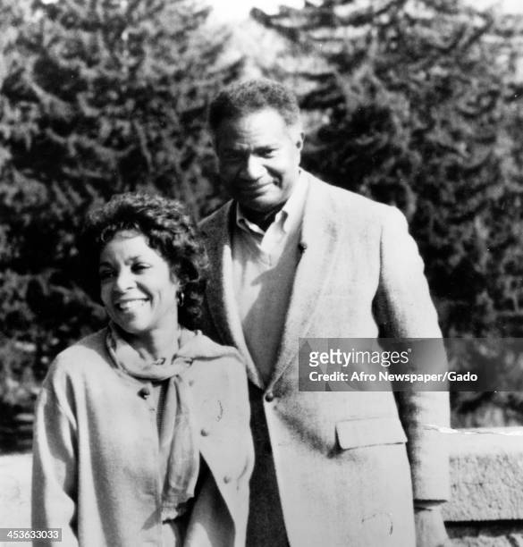 African American actor Ossie Davis with wife Ruby Dee outdoors, 1975.