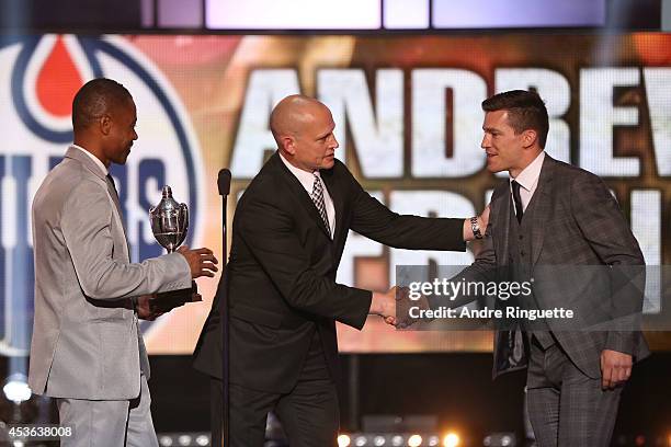 Actor Cuba Gooding Jr. And former NHL player Adam Graves present Andrew Ference of the Edmonton Oilers the King Clancy Memorial Trophy onstage during...