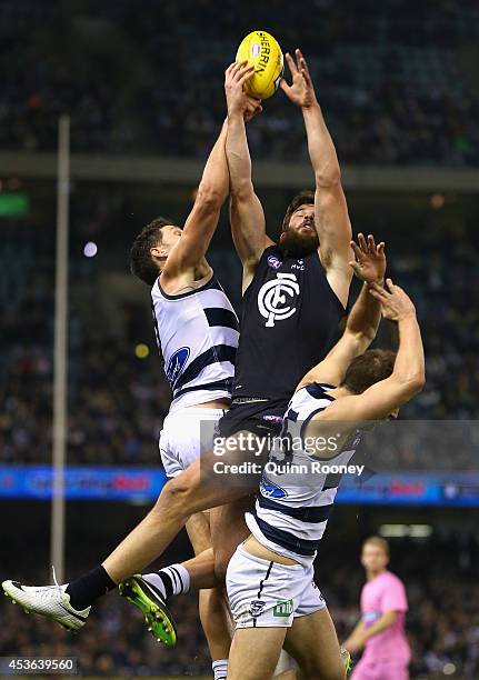 Levi Casboult of the Blues marks over the top of Jared Rivers of the Cats during the the round 21 AFL match between the Carlton Blues and the Geelong...