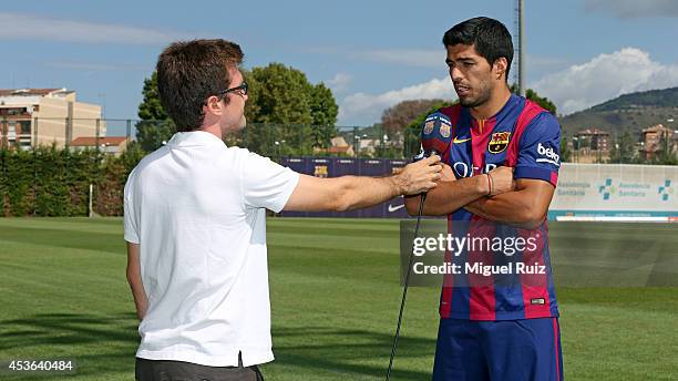 Luis Suarez of Barcelona is interviewed during a training session at the Ciutat Esportiva on August 15, 2014 in Barcelona, Spain.